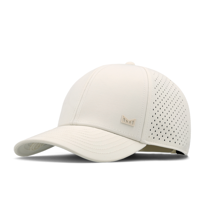 The angled view of the melin Vintage Fit A-Game Icon Hydro hat in egret
