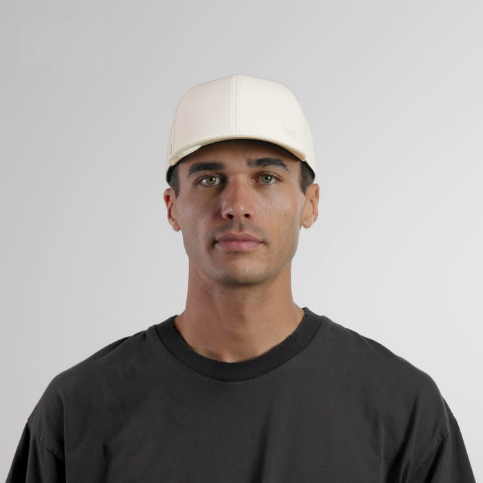 The model-image of the melin Vintage Fit A-Game Icon Hydro hat in egret
