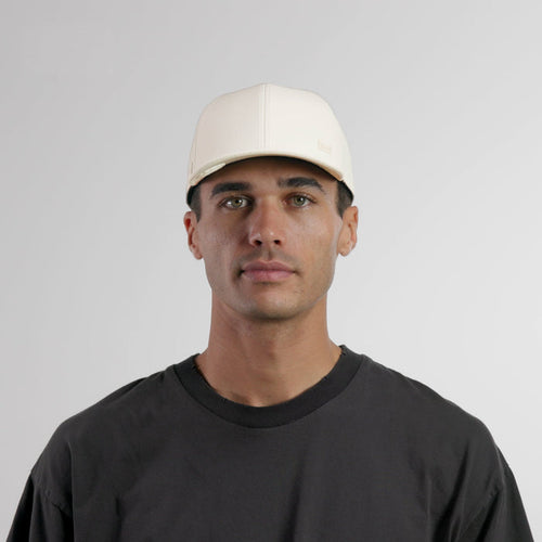 The model-image of the melin Vintage Fit A-Game Icon Hydro hat in egret