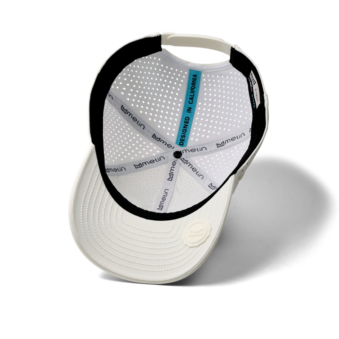 The inside view of the melin Vintage Fit A-Game Icon Hydro hat in egret