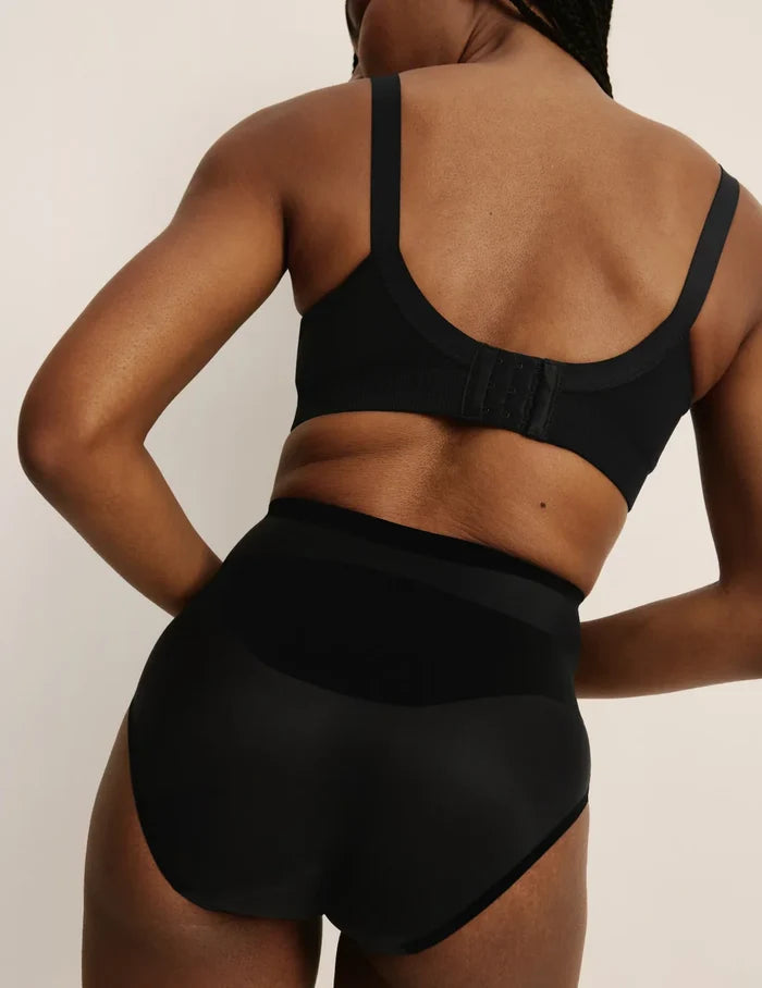 Gin is a 34DD and wearing KNIX M+ | Back view of model wearing the BlissFit™ Nursing Bra, highlighting the neckline, nursing clip strap design, and smooth silhouette | Black
