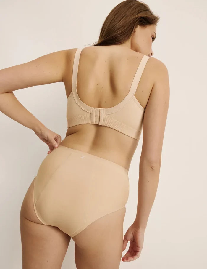 Sarah is a 34DD and wearing KNIX M+ | Back view of model wearing the BlissFit™ Nursing Bra, highlighting the neckline, nursing clip strap design, and smooth silhouette | Warm Sand