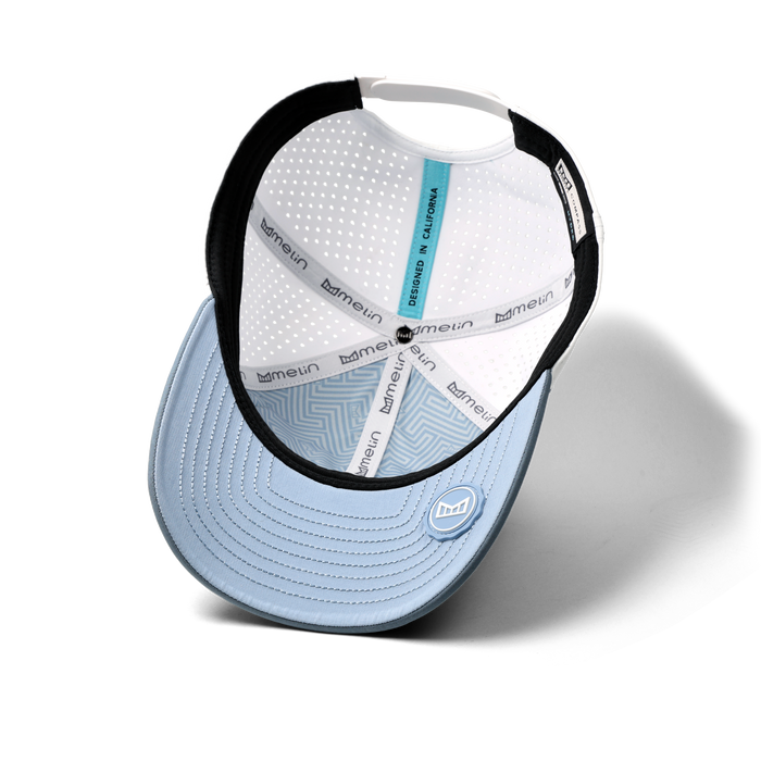 The inside view of the melin Vintage Fit Compass Hydro hat in clear lake