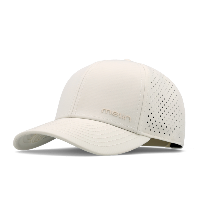 The angled view of the melin Vintage Fit Compass Hydro hat in egret