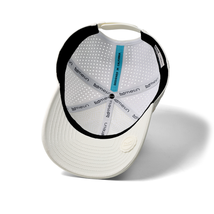 The inside view of the melin Vintage Fit Compass Hydro hat in egret