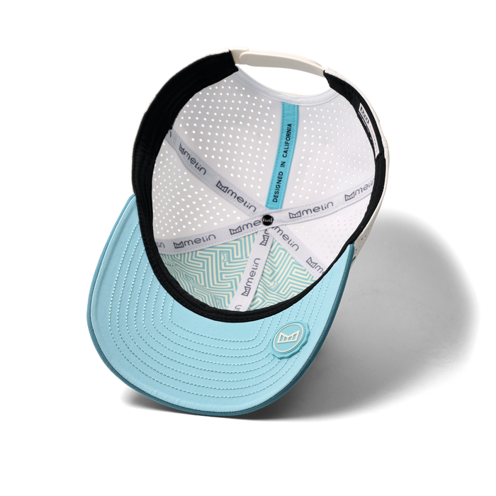 The inside view of the melin Vintage Fit Compass Hydro hat in riverwalk