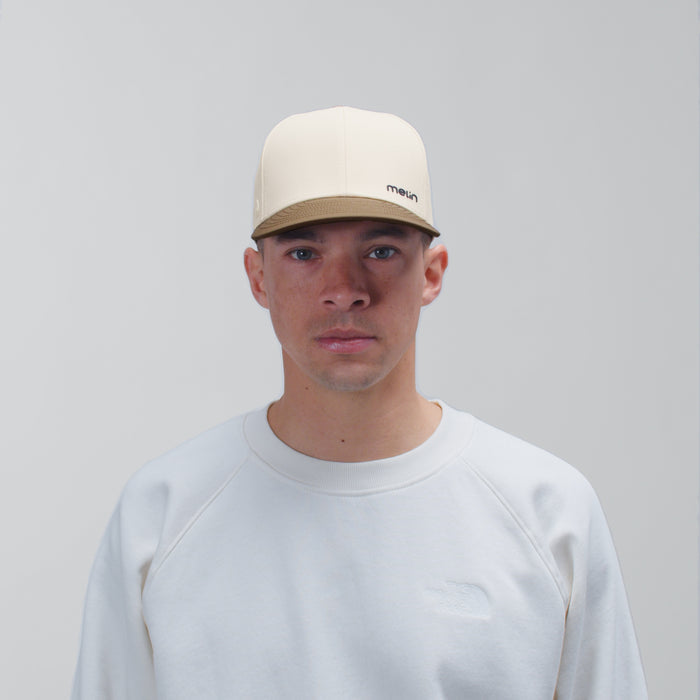 The model-image view of the melin Vintage Fit Compass Hydro hat in Yellow Jacket