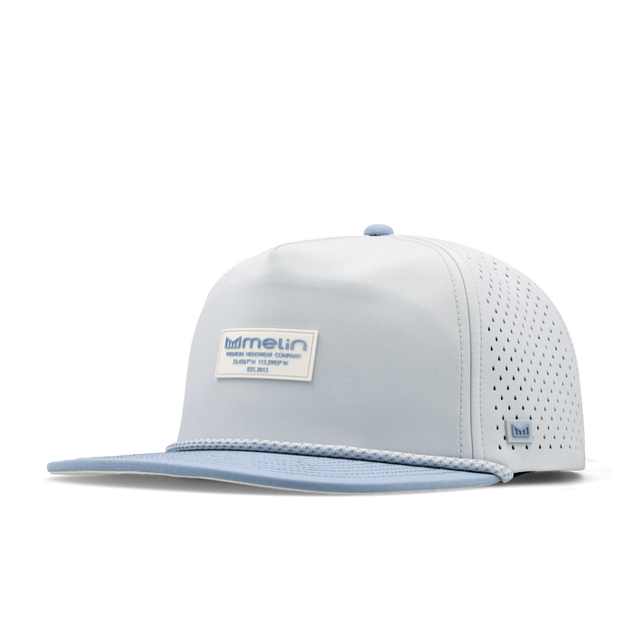 The angled view of the melin Split Crushed Fit Coronado Brick Hydro hat in clear lake