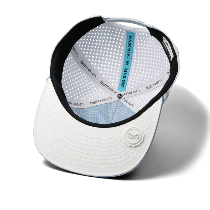 The inside view of the melin Split Crushed Fit Coronado Brick Hydro hat in clear lake