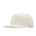 The angled view of the melin Split Crushed Fit Coronado Brick Hydro hat in egret