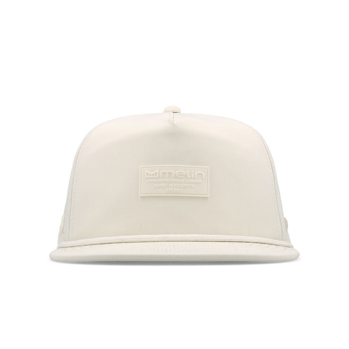 The frontal view of the melin Split Crushed Fit Coronado Brick Hydro hat in egret