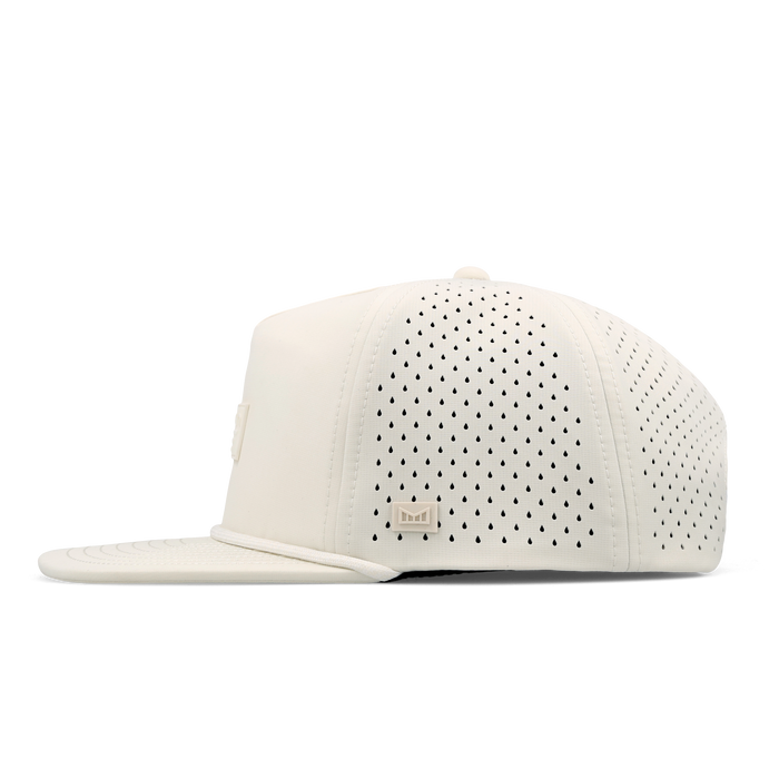 The side view of the melin Split Crushed Fit Coronado Brick Hydro hat in egret