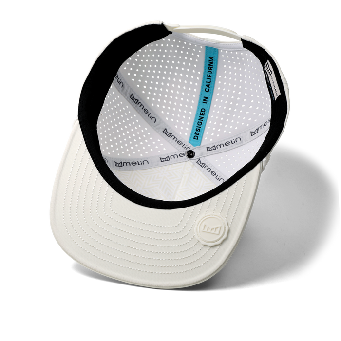 The inside view of the melin Split Crushed Fit Coronado Brick Hydro hat in egret