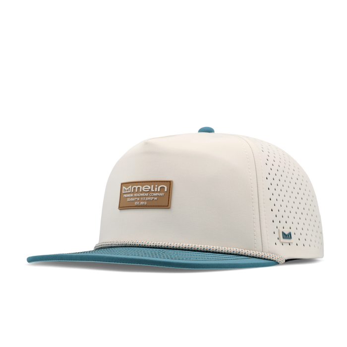 The angled view of the melin Split Crushed Fit Coronado Brick Hydro hat in riverwalk