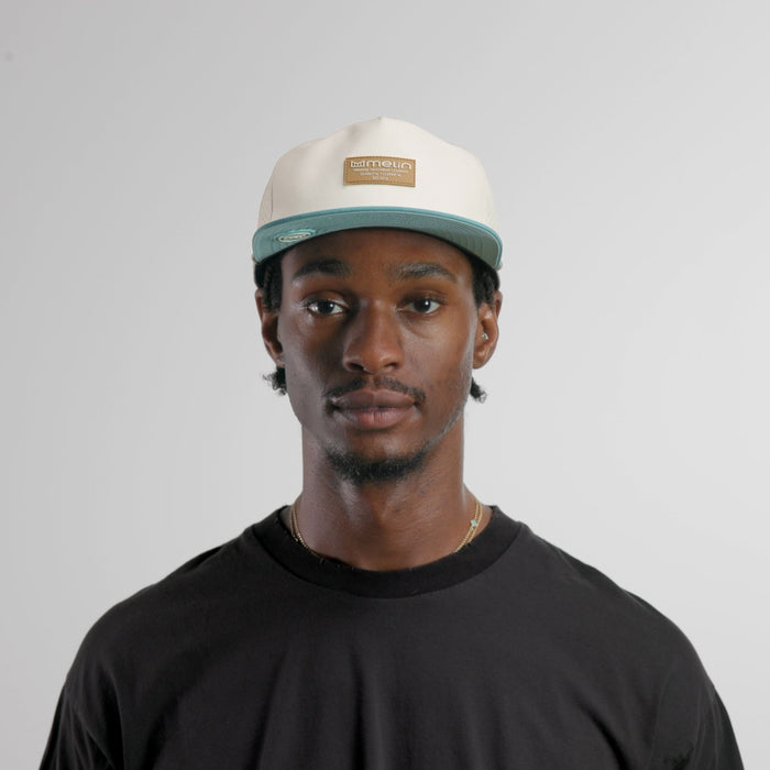 The model-image of the melin Split Crushed Fit Coronado Brick Hydro hat in riverwalk