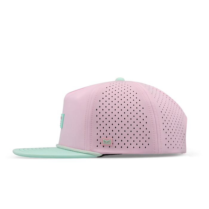 The side view of the melin Split Crushed Fit Coronado Brick Hydro hat in south beach