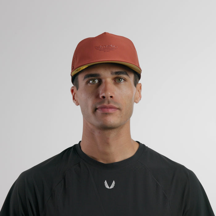 The model-image of the melin Split Crushed Fit Coronado Hydrolite hat in burnt brick
