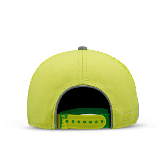 The back view of the melin Odysea Links Trashed Hydro  Split Fit in  Safety Green