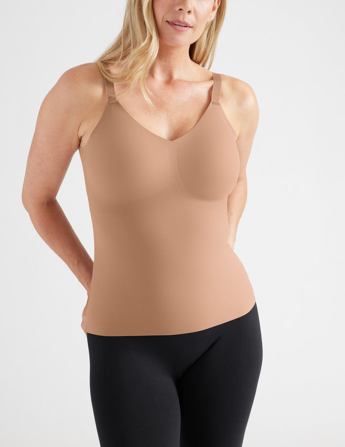Amber is a 34DD, has 38" hips and wears a Knix size M | Front view of model wearing the LuxeLift V-Neck Tank, highlighting the neckline, strap design, and silhouette | Cavassa
