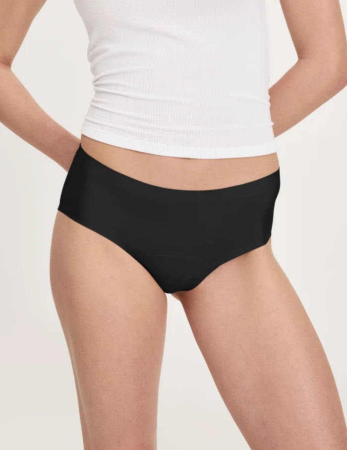 | Front view of model wearing the Teen Leakproof UltraThin No-Show Boyshort highlighting the coverage and smooth fit | Black