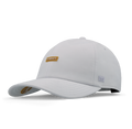 The front, angled view of the melin The Legend Hydro  Performance Dad Hat in  White / Gum