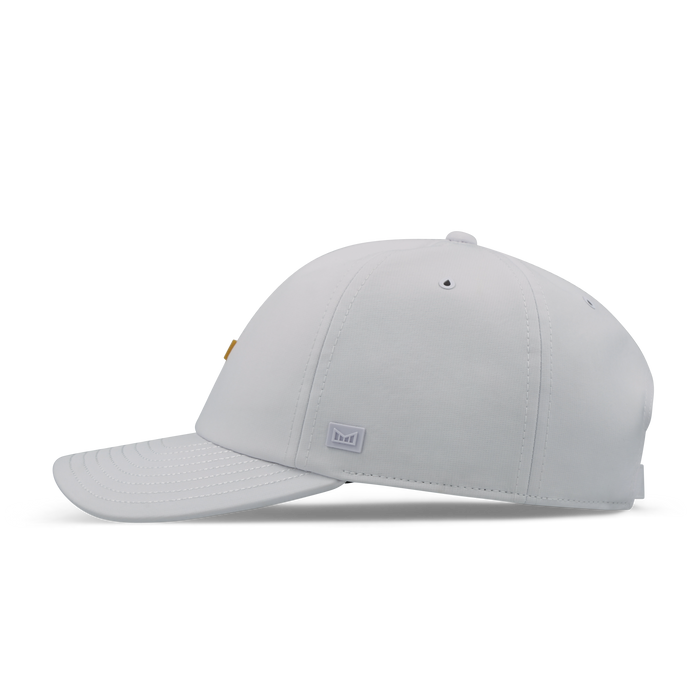 The side view of the melin The Legend Hydro  Performance Dad Hat in  White / Gum