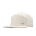 The angled view of the melin Horizon Fit Trenches Icon Hydro hat in egret