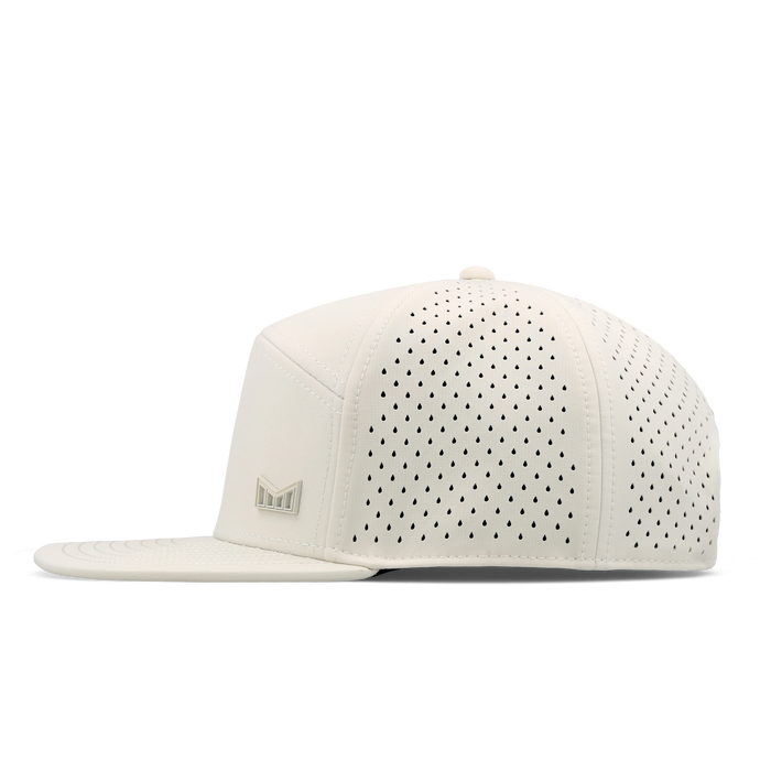 The side view of the melin Horizon Fit Trenches Icon Hydro hat in egret