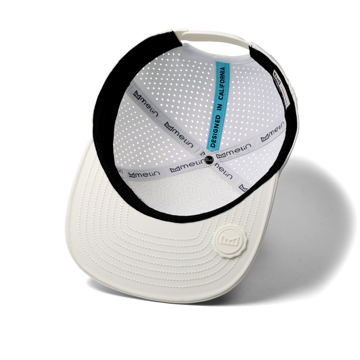 The inside view of the melin Horizon Fit Trenches Icon Hydro hat in egret