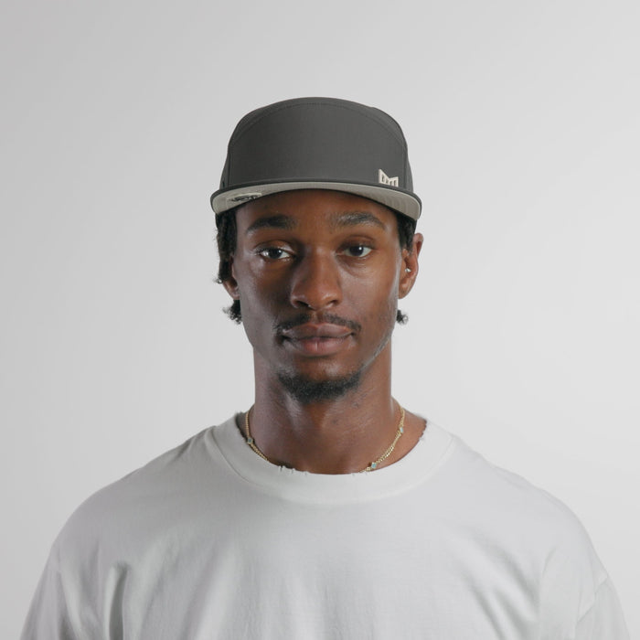 The model-image of the melin Horizon Fit Trenches Icon Hydro hat in faded black