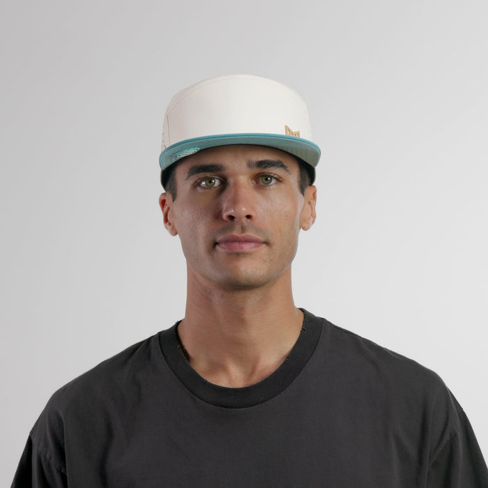The model-image of the melin Horizon Fit Trenches Icon Hydro hat in riverwalk