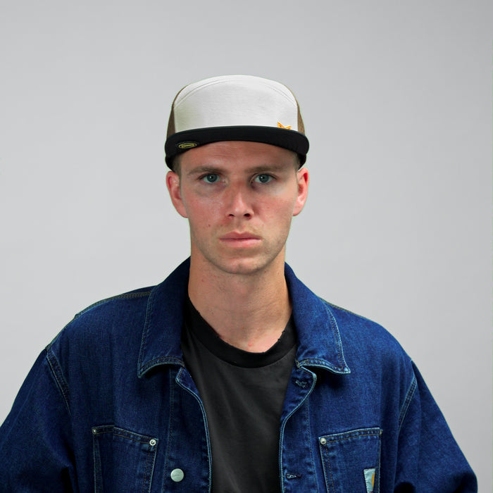 The model-image view of the melin Horizon Fit Trenches Hydro hat in Yellow Jacket